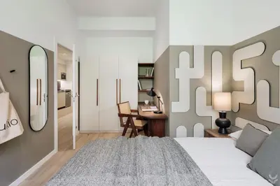 a bedroom with a bed and a potted plant at Llum - 1 bedroom and balcony in Sant Antoni in Barcelona