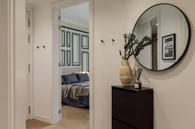 a living room with a couch and a table at Mavi - 2 bedrooms and balcony in Eixample Dreta in Barcelona