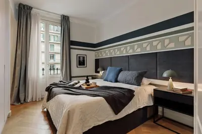 a bedroom with a bed and a mirror and a vase at Mavi - 2 bedrooms and balcony in Eixample Dreta in Barcelona