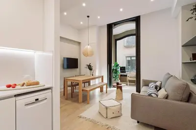 a bedroom with a bed and a mirror at Baronissi - 2 bedrooms and terrace in Ciutat Vella in Barcelona