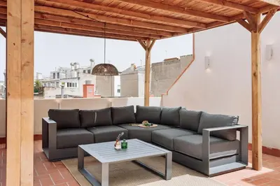 a white kitchen with a washing machine and a sink at Baronissi - 2 bedrooms and terrace in Ciutat Vella in Barcelona
