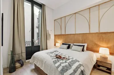a patio with a couch and a table and chairs at Baronissi - 2 bedrooms and terrace in Ciutat Vella in Barcelona