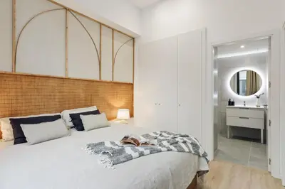 a bedroom with a large bed and a large window at Baronissi - 2 bedrooms and terrace in Ciutat Vella in Barcelona