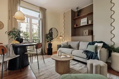 a bedroom with a bed and a large window at Edera - 3 bedrooms and balcony in Eixample Dreta in Barcelona