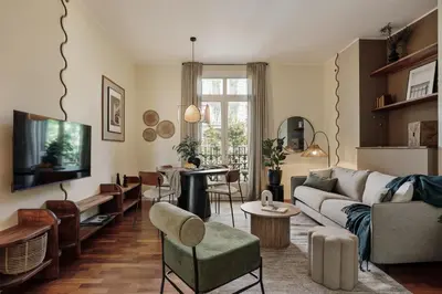 a bedroom with a bed and a desk and a window at Edera - 3 bedrooms and balcony in Eixample Dreta in Barcelona