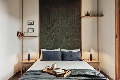 a bedroom with a bed and a sliding glass door at Ada - 2 bedrooms and balcony in Eixample Dreta in Barcelona