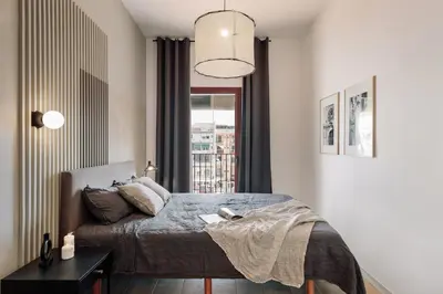 a dining room and living room with a table and chairs at Albera - 2 bedrooms in Sant Antoni in Barcelona