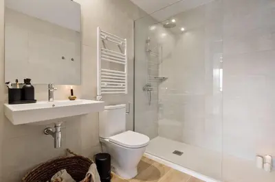 a bedroom with a bed and a desk and a bed and a table at Albera - 2 bedrooms in Sant Antoni in Barcelona
