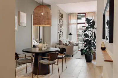 a living room with a couch and a large window at Albera - 2 bedrooms in Sant Antoni in Barcelona