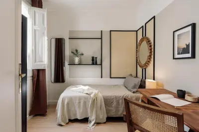 a dining room with a table and chairs at Solea - 3 bedrooms and balcony in Eixample Dreta in Barcelona