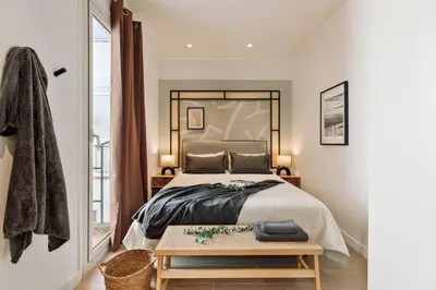 a living room with a mirror and a table at Solea - 3 bedrooms and balcony in Eixample Dreta in Barcelona