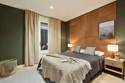 a living room with a couch and a table at Arlet - 4 bedrooms in Eixample Dreta in Barcelona