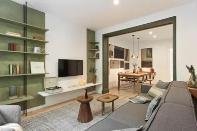 a bedroom with a large bed and two lamps at Arlet - 4 bedrooms in Eixample Dreta in Barcelona