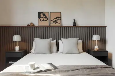 a living room with a couch and a table at Serre - Studio in Eixample Dreta in Barcelona