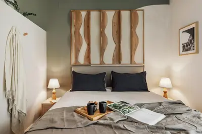 a living room with a couch and shelves at Freso - Studio in Eixample Esquerra in Barcelona