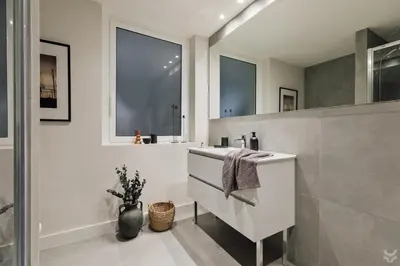 a bathroom with a sink and a mirror at Sariyer - 2 bedrooms and balcony in El Putxet in Barcelona