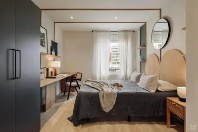 a living room with a couch and a table at Sariyer - 2 bedrooms and balcony in El Putxet in Barcelona