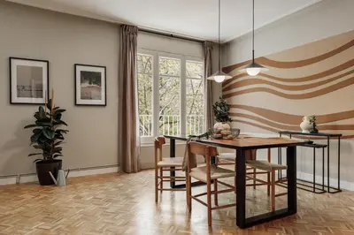 a table with a chair and a mirror in a room at Cahuita - 2 bedrooms and office in Sants in Barcelona
