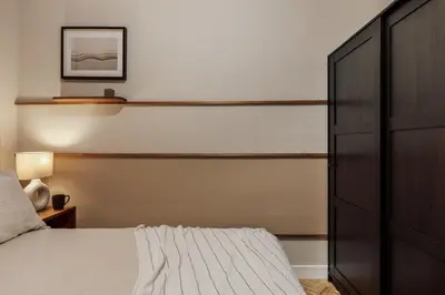 a bedroom with a bed and two lamps in it at Cahuita - 2 bedrooms and office in Sants in Barcelona
