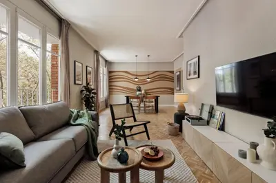 a kitchen with white cabinets and a counter top at Cahuita - 2 bedrooms and office in Sants in Barcelona