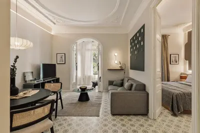 a bedroom with a bed and a window at Cumulus - 2 bedrooms and balcony in Vila de Gràcia in Barcelona