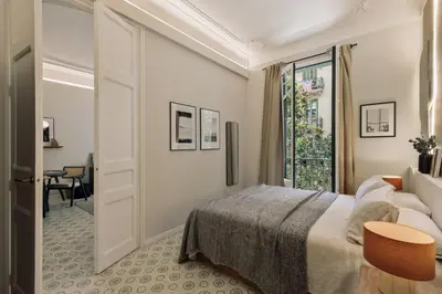 a bedroom with a bed and a window at Cumulus - 2 bedrooms and balcony in Vila de Gràcia in Barcelona