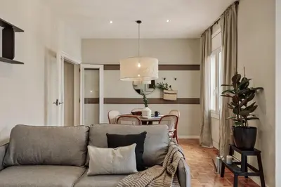 a hallway with a mirror and a dresser at Amani - 3 bedrooms in Vila de Gràcia in Barcelona
