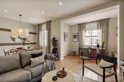 a living room with a couch and a tv at Amani - 3 bedrooms in Vila de Gràcia in Barcelona
