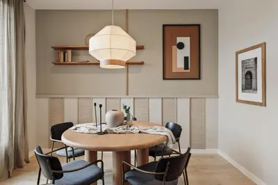 a hallway with white walls and a wooden table and a mirror at Davut - 3 bedrooms and office in Eixample Esquerra in Barcelona