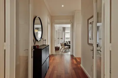 a home office with a desk and a mirror at Sark - 3 bedrooms and balcony in Sant Gervasi in Barcelona