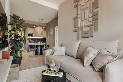 a living room with a couch and a table at Fageda - 2 bedrooms and balcony in Sant Antoni in Barcelona