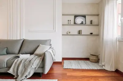 a bedroom with a bed with a book on it at Tramonto - 3 bedrooms and balcony in Sant Antoni in Barcelona