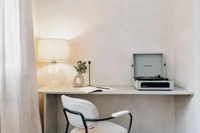 a bedroom with a bed in a white room at Tramonto - 3 bedrooms and balcony in Sant Antoni in Barcelona