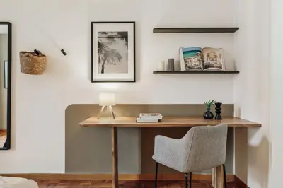 a living room with a couch and a table at Nicoya - 3 bedrooms and balcony in Eixample Dreta in Barcelona