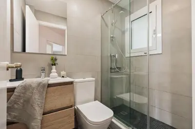 a desk with a lamp and a chair in a room at Nicoya - 3 bedrooms and balcony in Eixample Dreta in Barcelona