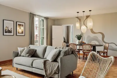 a dining room with a tree mural on the wall at Nicoya - 3 bedrooms and balcony in Eixample Dreta in Barcelona