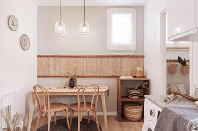 a hallway with a door leading into a dining room at Nerja - 1 bedroom and terrace in Sant Gervasi in Barcelona