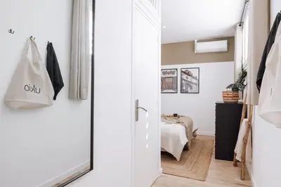a patio with a couch and a table at Nerja - 1 bedroom and terrace in Sant Gervasi in Barcelona