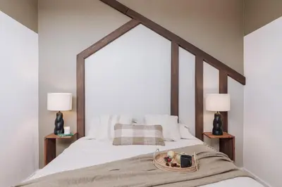 a bedroom with a white bed with a large window at Nerja - 1 bedroom and terrace in Sant Gervasi in Barcelona