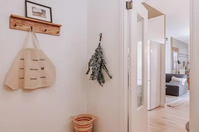 a living room with a desk and a tv at Nerja - 1 bedroom and terrace in Sant Gervasi in Barcelona