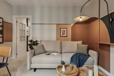 a bedroom with a mirror and a bed and a window at Yesil - 2 bedrooms and office in Sant Antoni in Barcelona