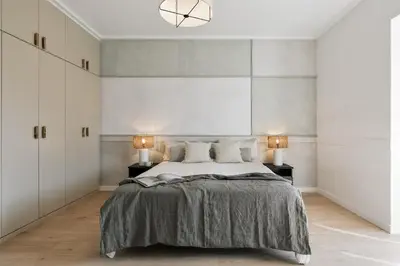 a bedroom with a large bed and a mirror at Rama - 3 bedrooms and terrace in Sant Gervasi in Barcelona