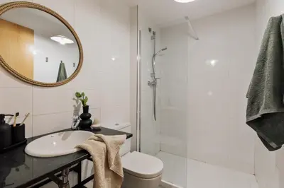 a bedroom with a bed with a book on it at Mercan - 2 bedrooms in Sant Pere in Barcelona