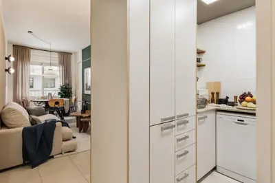 a living room with a couch and a table at Caliph - 2 bedrooms and office in El Putxet i el Farró in Barcelona