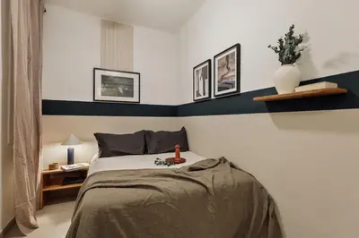 a hallway with a mirror and a table at Caliph - 2 bedrooms and office in El Putxet i el Farró in Barcelona