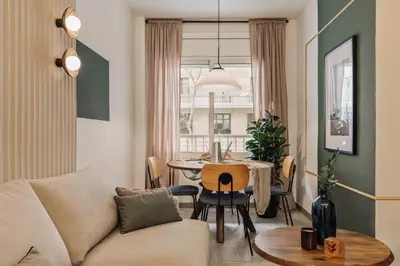 a bedroom with white walls and a bed and a mirror at Caliph - 2 bedrooms and office in El Putxet i el Farró in Barcelona
