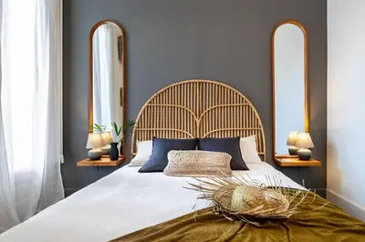 a bedroom with a large bed with two tables and two lamps at Depok - 2 bedrooms and balcony in Eixample Dreta in Barcelona