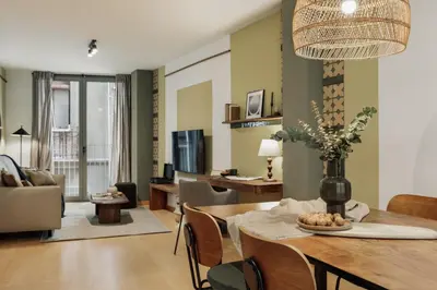 a living room with a couch and a tv at Peri - 2 bedrooms in Sant Pere in Barcelona