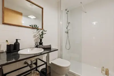 a bedroom with a bed with a book on it at Peri - 2 bedrooms in Sant Pere in Barcelona