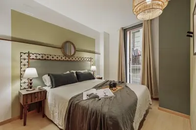 a bedroom with a large bed and a window at Peri - 2 bedrooms in Sant Pere in Barcelona
